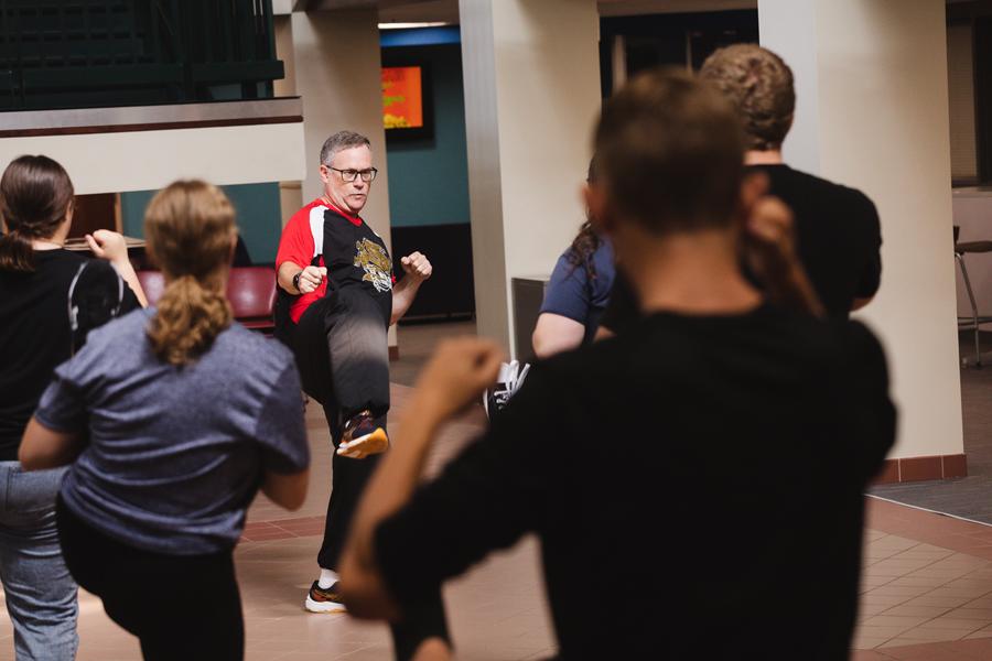 Dr. Mark Meysenburg teaches students basic taekwondo moves during Tiger Takeoff, in Nyrop Hall in Perry Campus Center. 